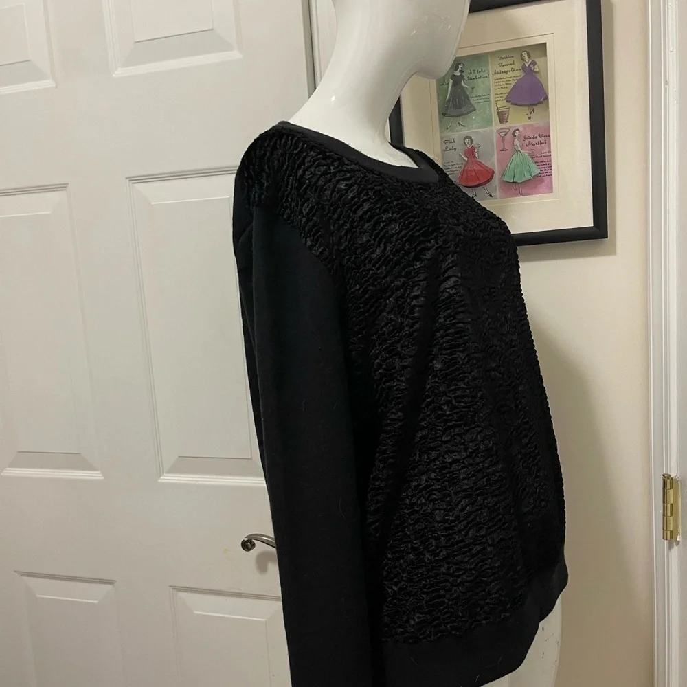 Kate spade black sweater. Looks like Front made with the unique sheep fur.